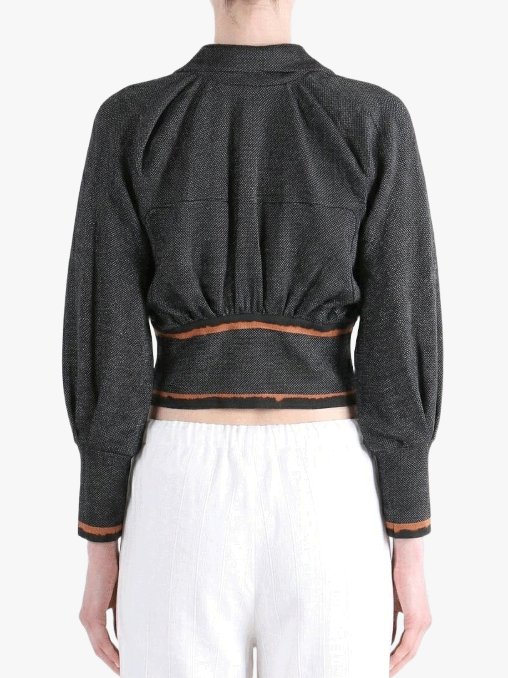 Black jacket worn by a person, back view