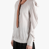 white top worn by a person, showing the top fit