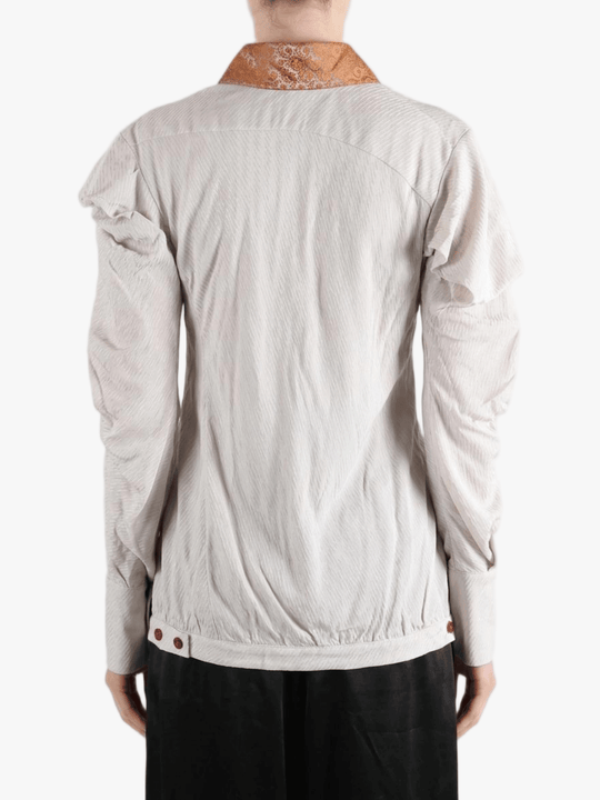 white top worn by a person, showing the top fit