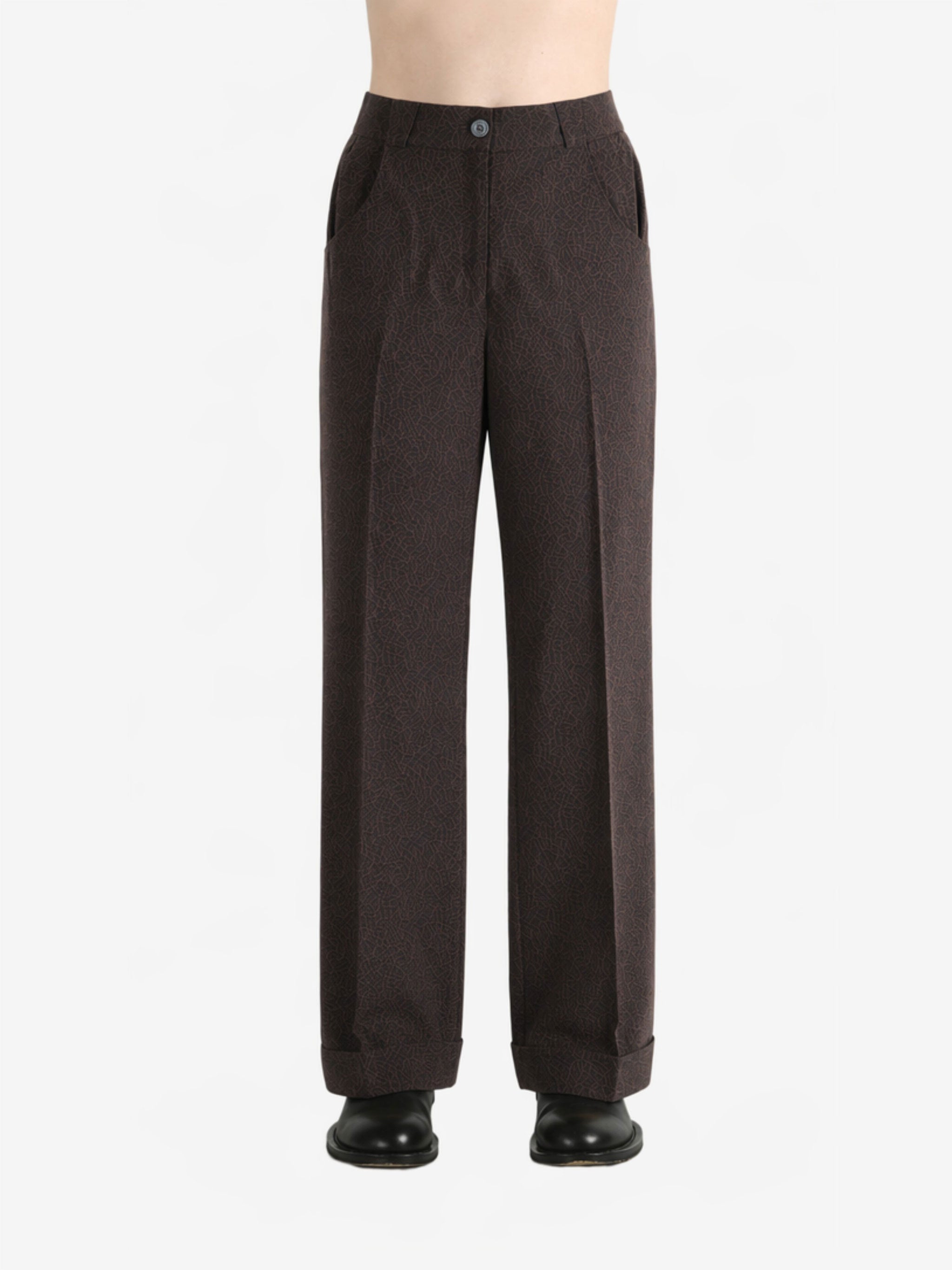 Brown pants worn by a person, showing the pants fit