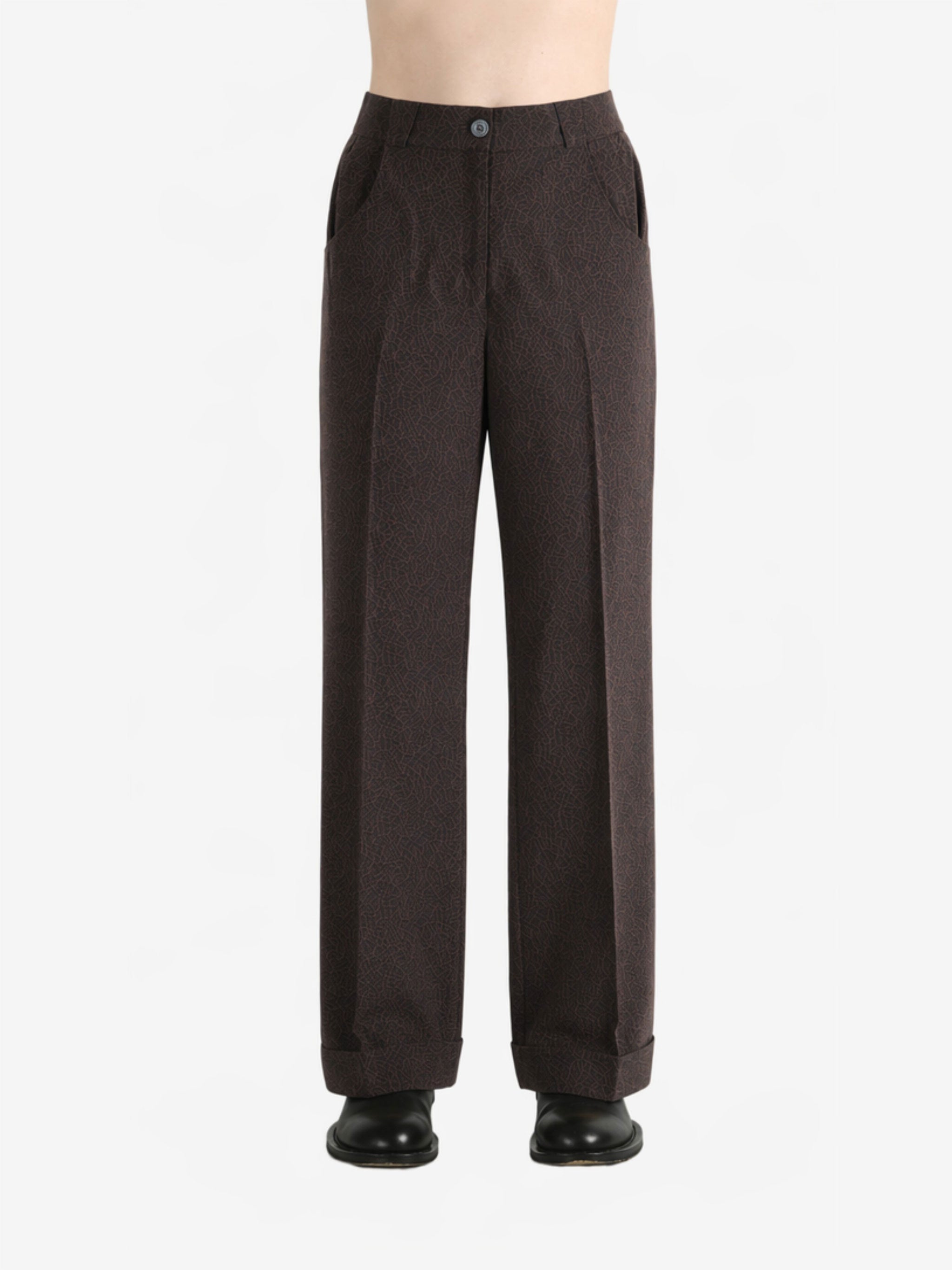Brown pants worn by a person, showing the pants fit