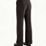 Brown pants worn by a person, side view