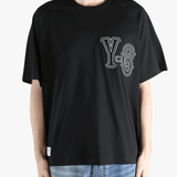 black t-shirts worn by a person, showing the t-shirts fit