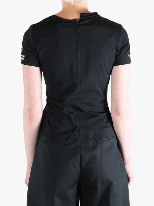 Black t-shirt worn by a person, showing the t-shirt's fit