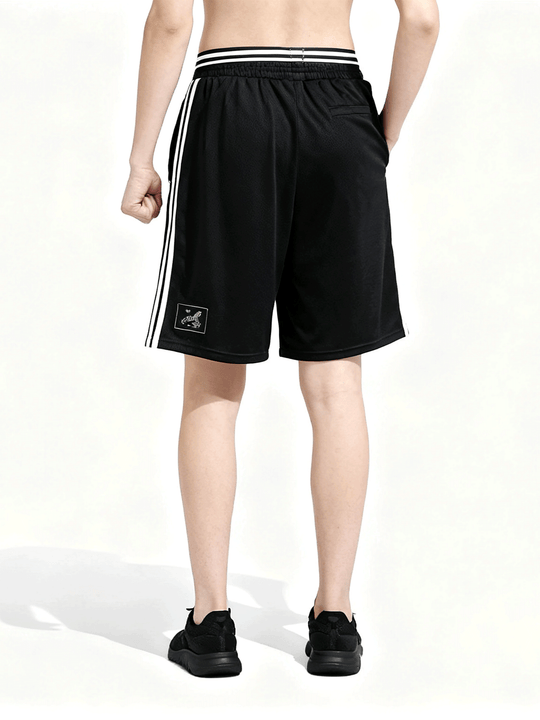 Black shorts worn by a person, back view