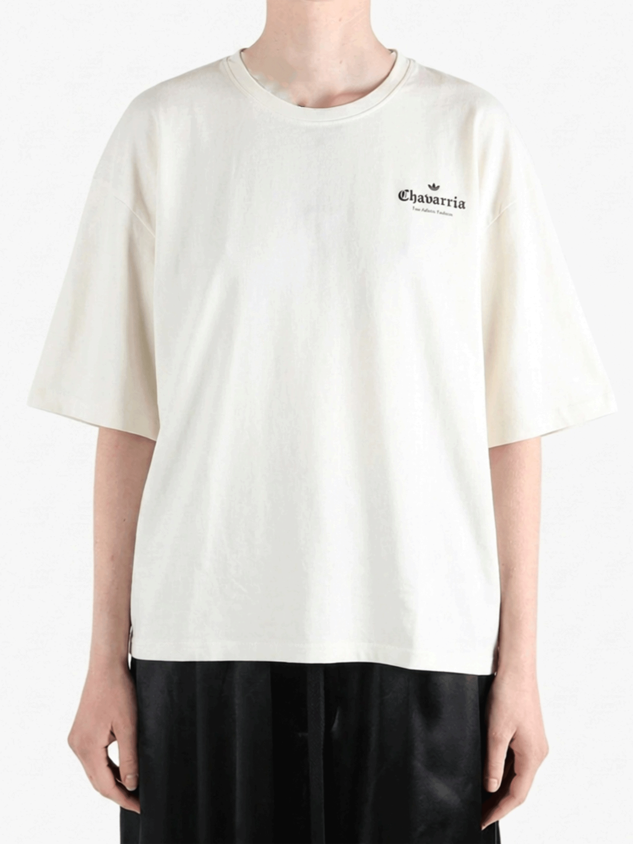 White top worn by a person, showing the top fit