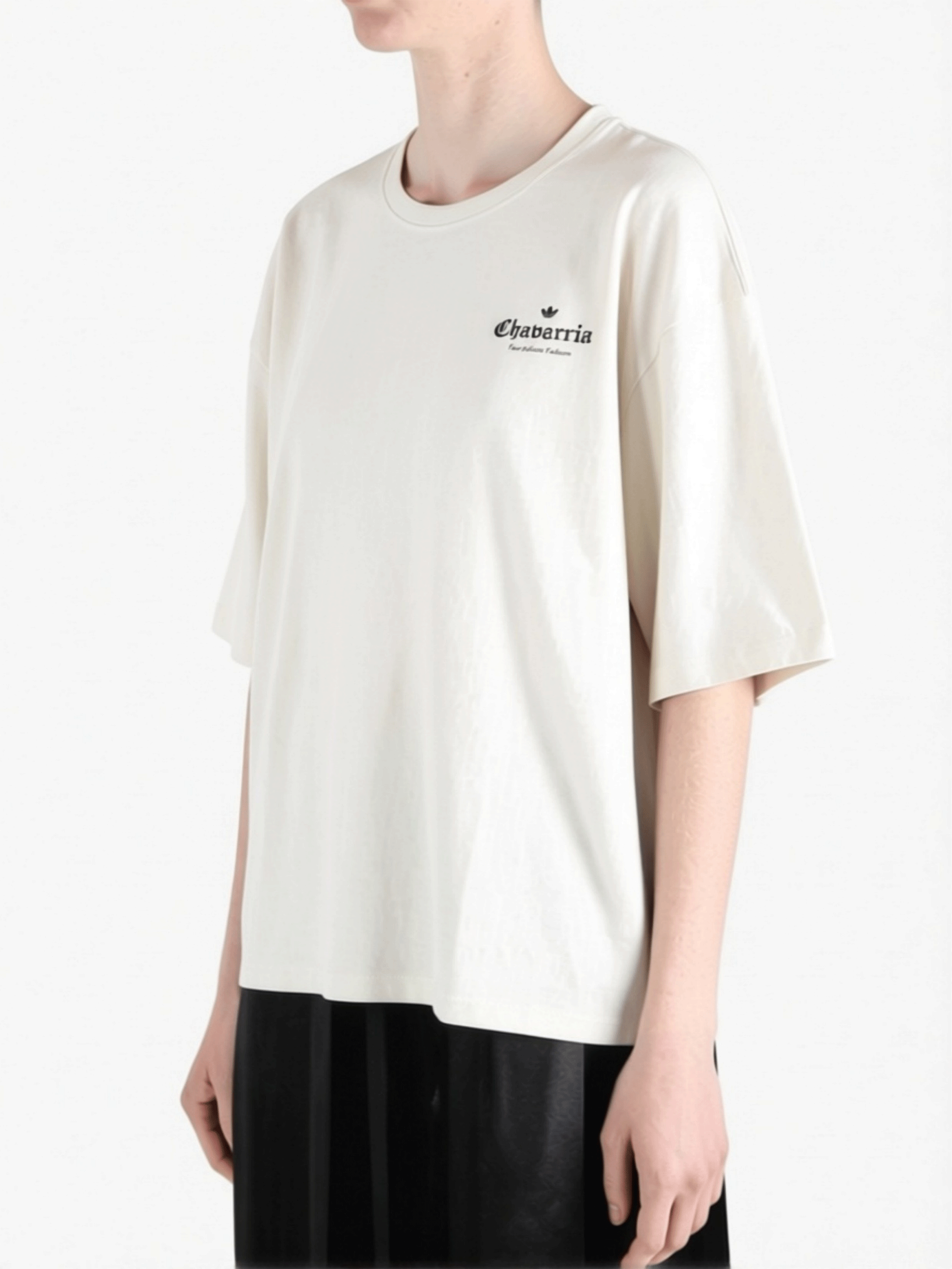 White top worn by a person, side view