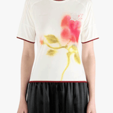 White top worn by a person, showing the top fit