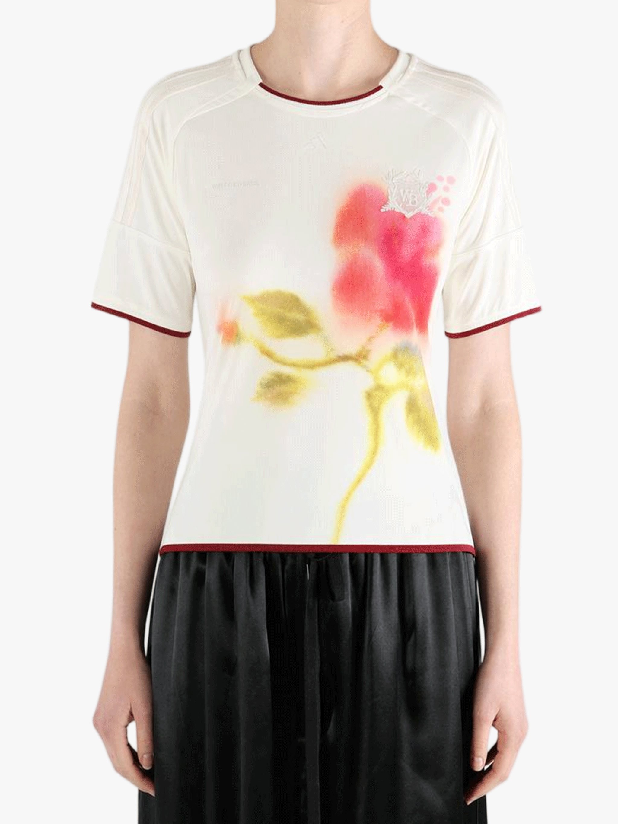 White top worn by a person, showing the top fit