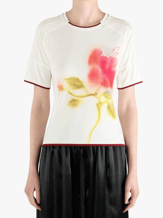 White top worn by a person, showing the top fit
