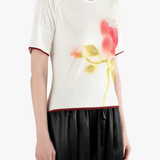 White top worn by a person, showing the top fit