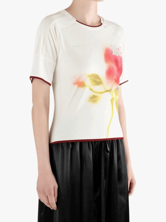 White top worn by a person, showing the top fit