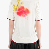 White top worn by a person, showing the top fit
