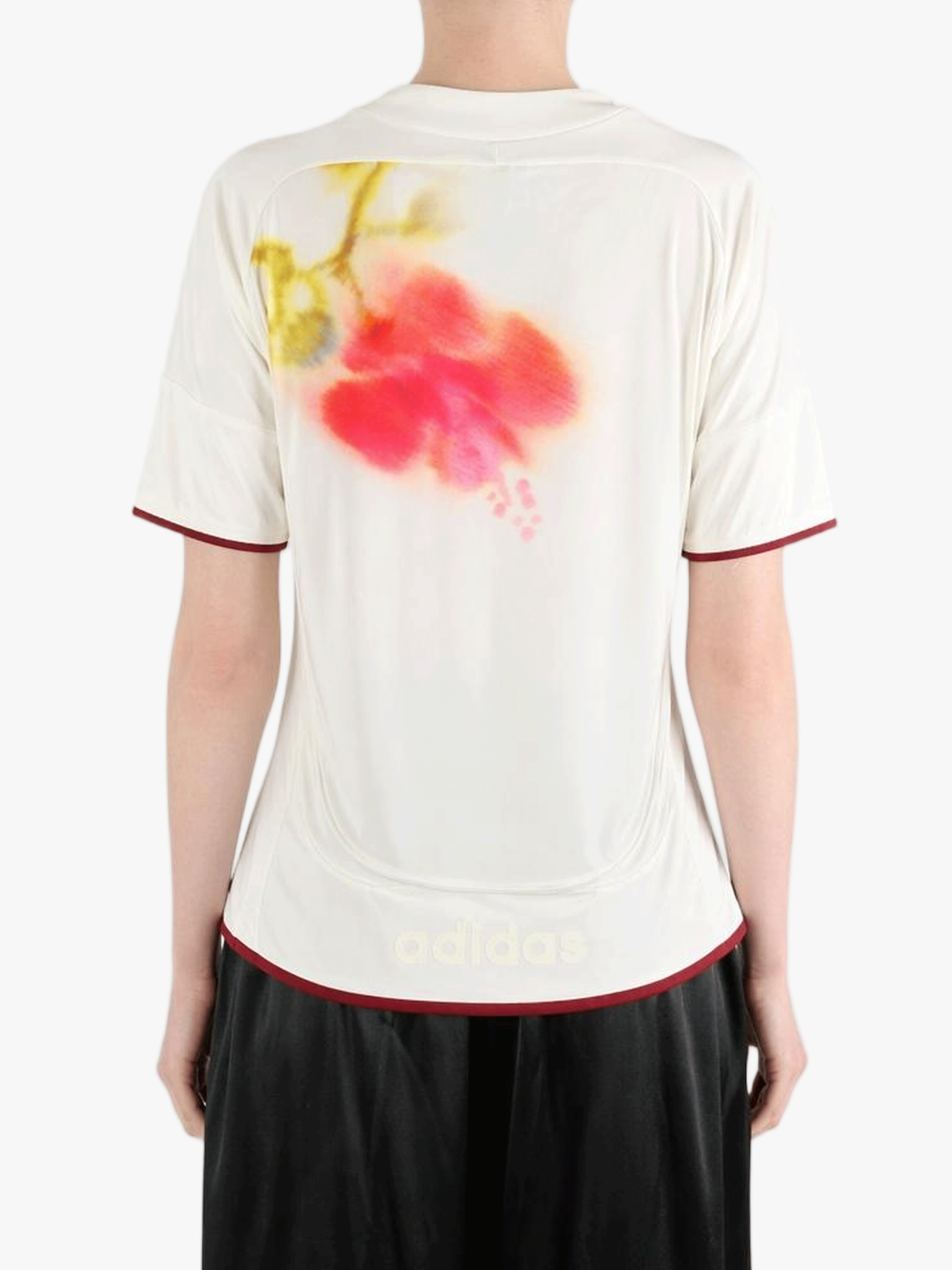 White top worn by a person, showing the top fit