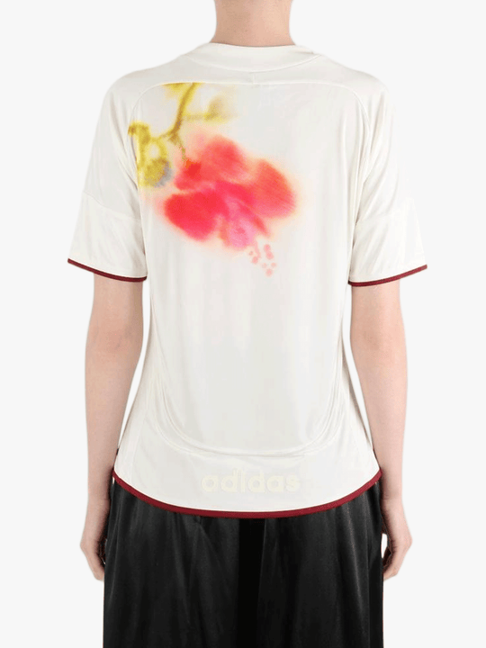 White top worn by a person, showing the top fit