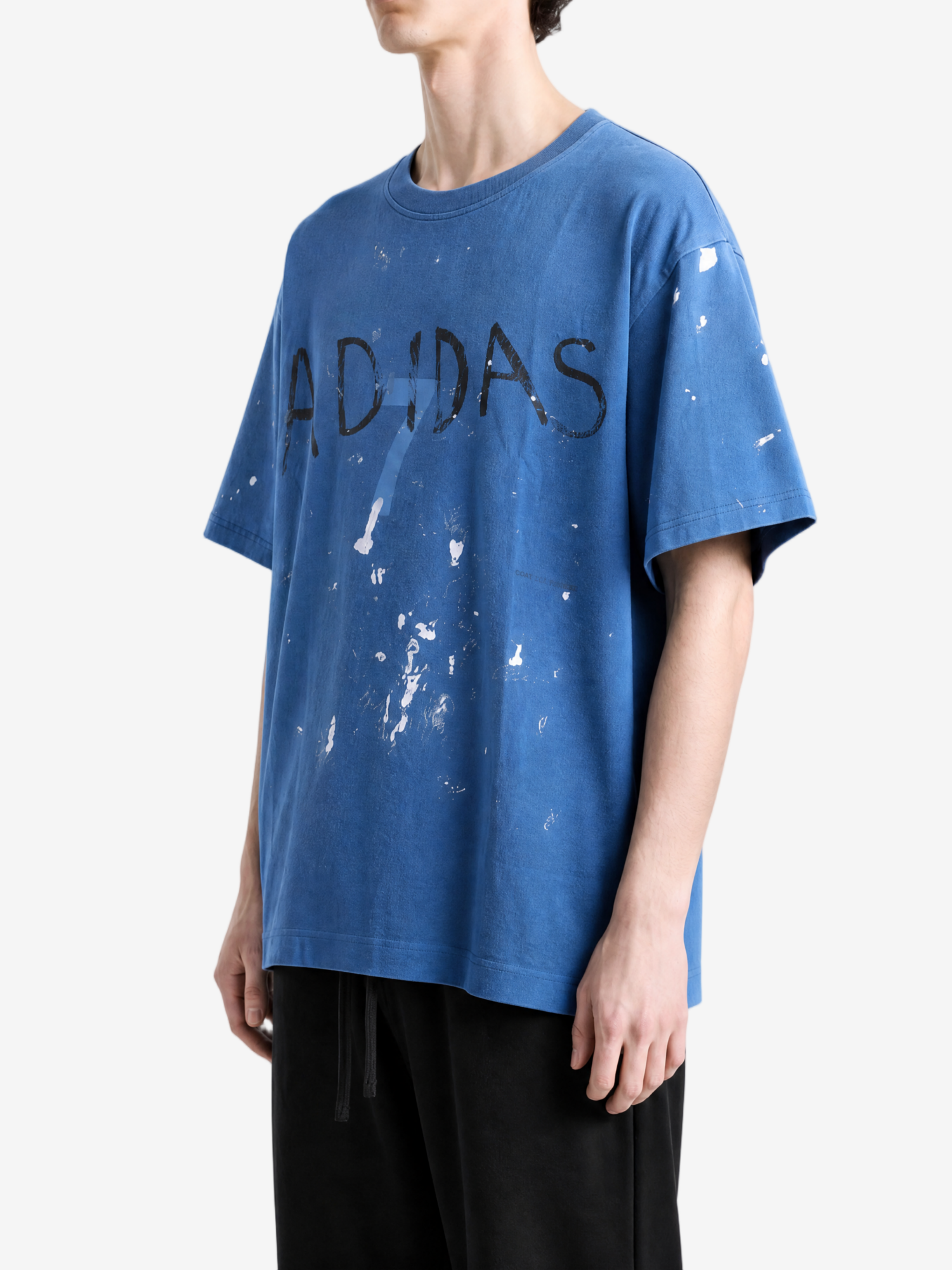 Blue t-shirt worn by a person, showing the t-shirt fit
