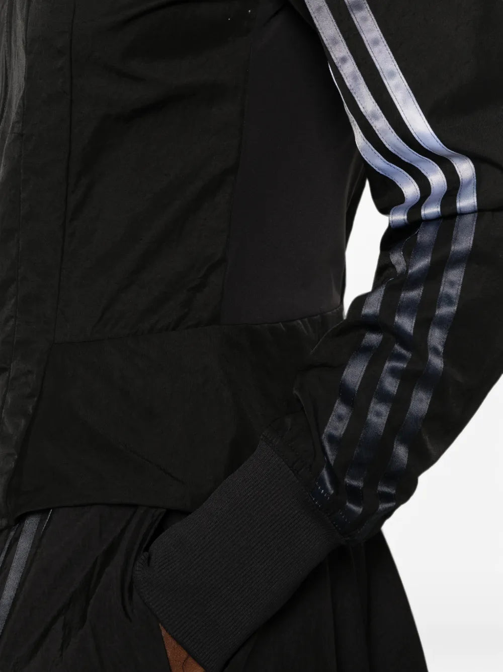 Black top worn by a person, showing the top fit