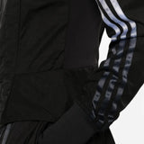 Black top worn by a person, showing the top fit