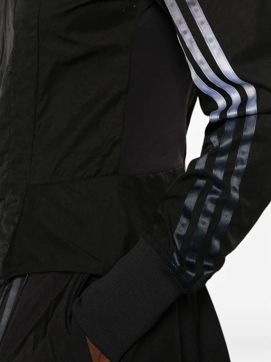 Black top worn by a person, showing the top fit