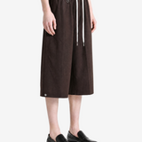 Brown pants worn by a person, showing the pants fit