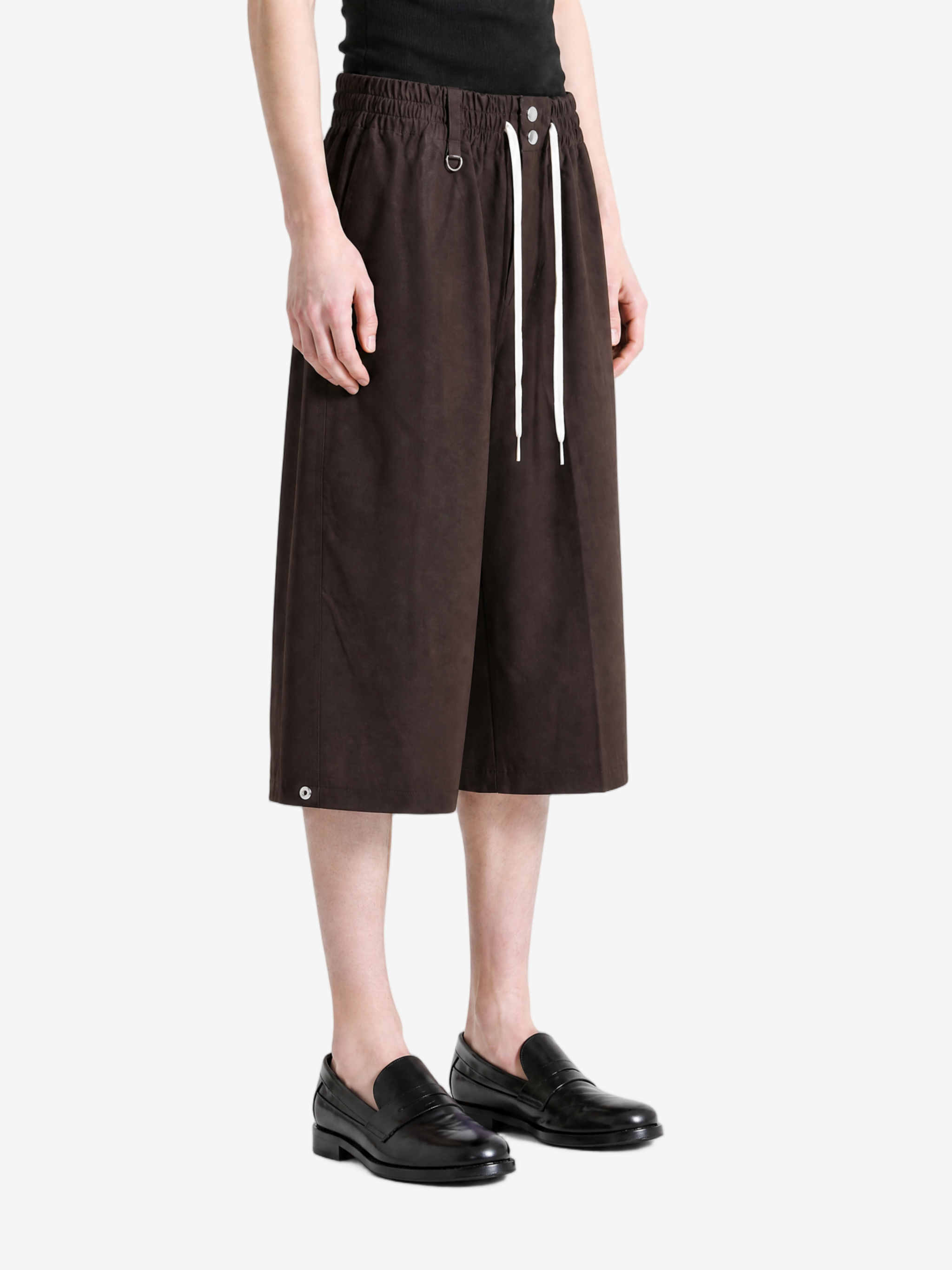 Brown pants worn by a person, showing the pants fit