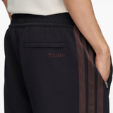 Navy pants worn by a person, showing the pants fit