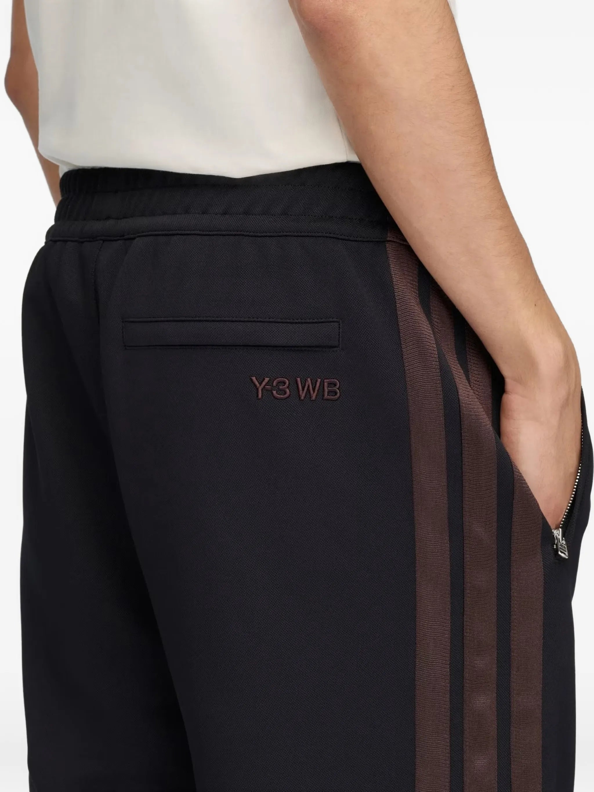 Navy pants worn by a person, showing the pants fit