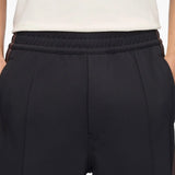 Navy pants worn by a person, showing the pants fit