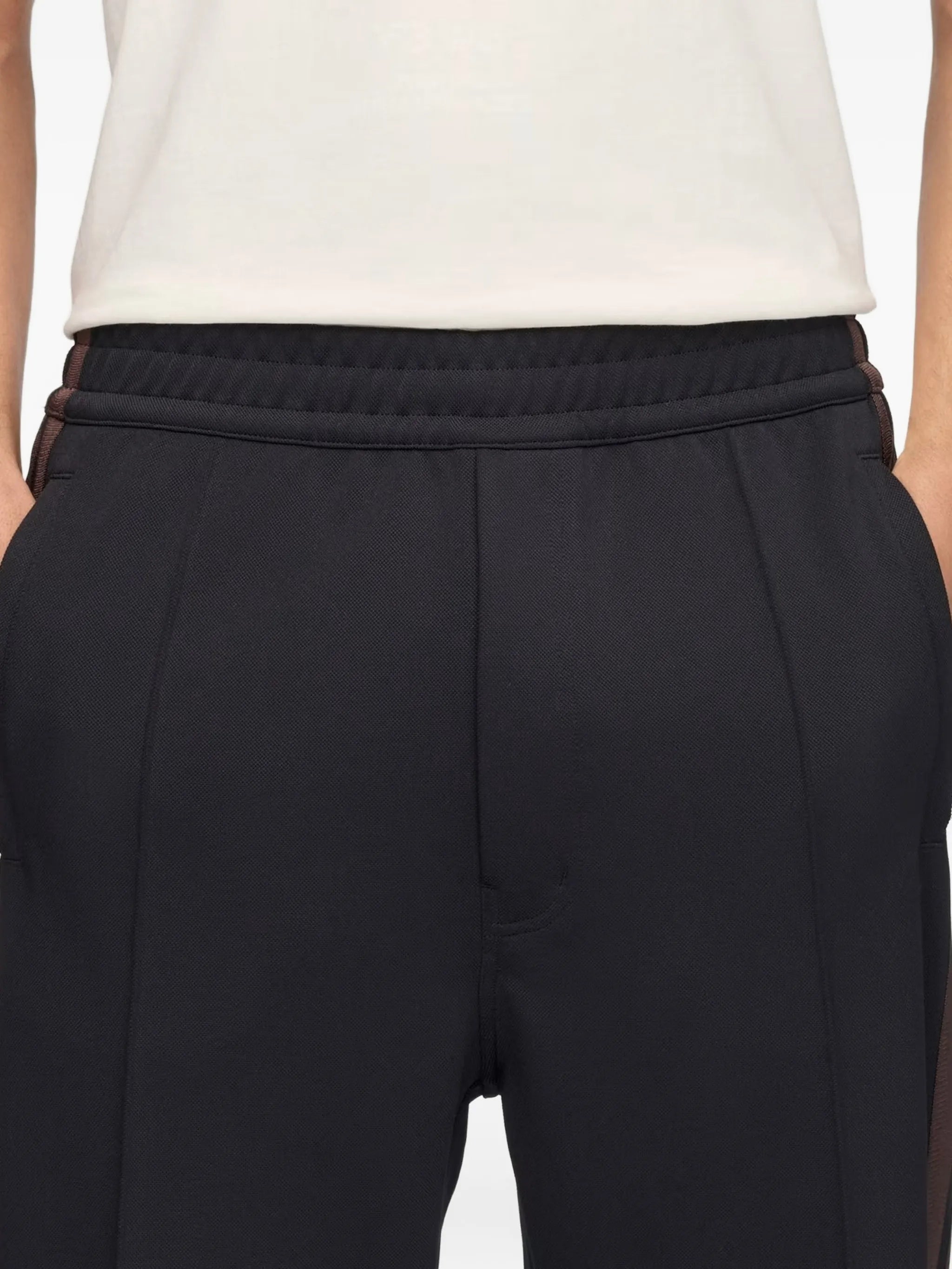 Navy pants worn by a person, showing the pants fit