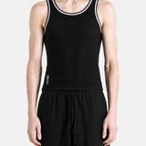 Black top worn by a person, showing the top fit