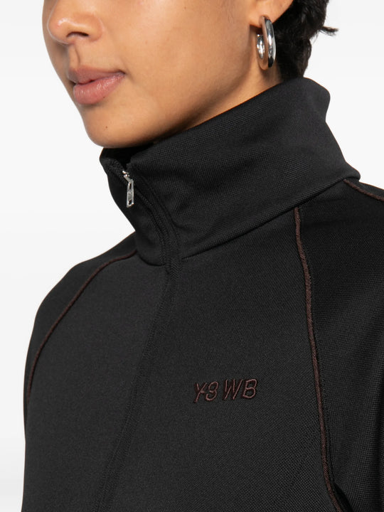 Black jacket worn by a person, showing the jacket fit