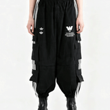 Black pants worn by a person, showing the pants's fit