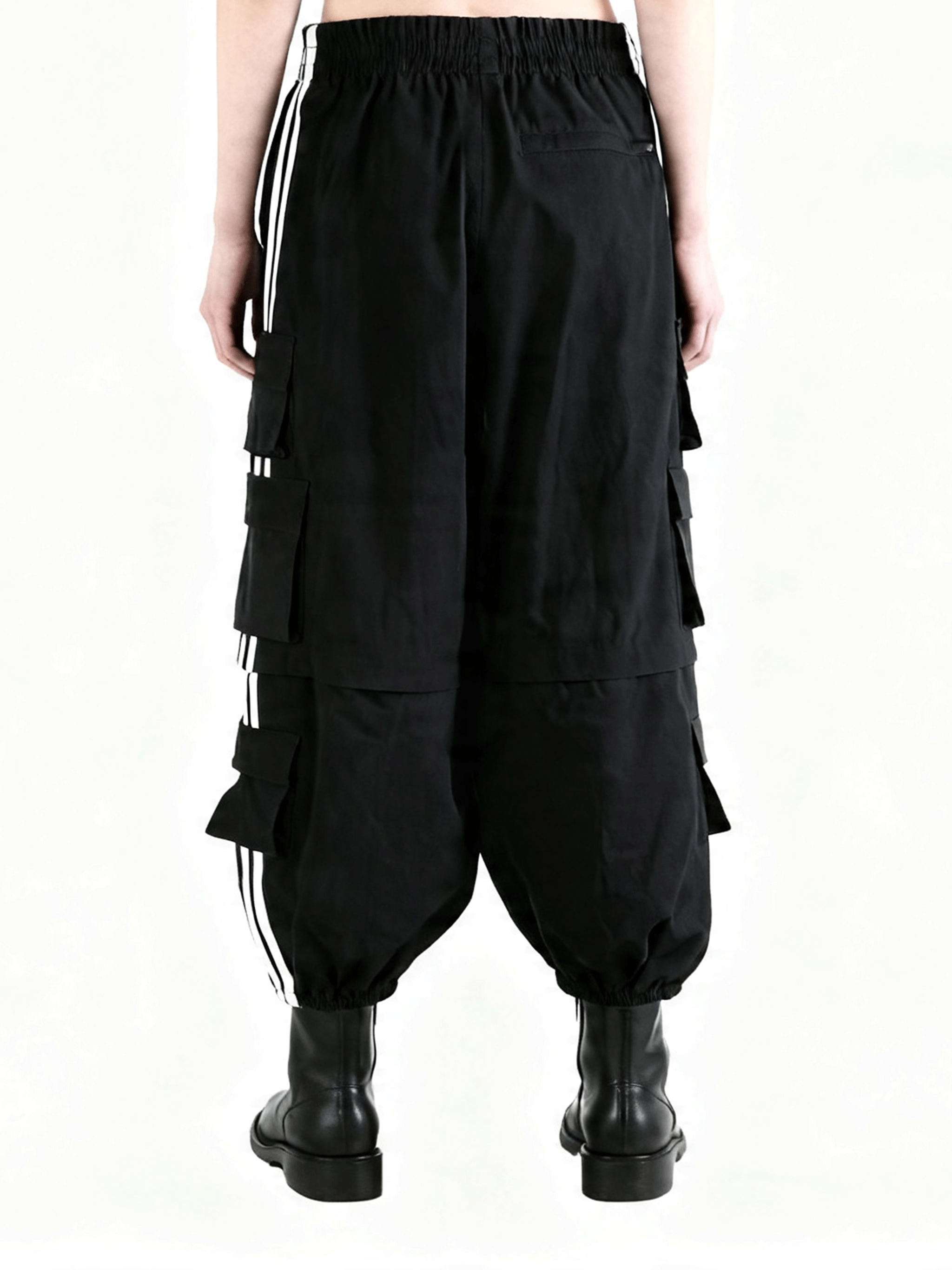 Black pants worn by a person, showing the pants's fit