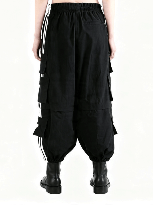 Black pants worn by a person, showing the pants's fit