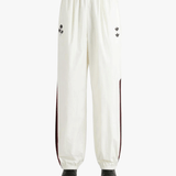 White pants worn by a person, showing the pants fit