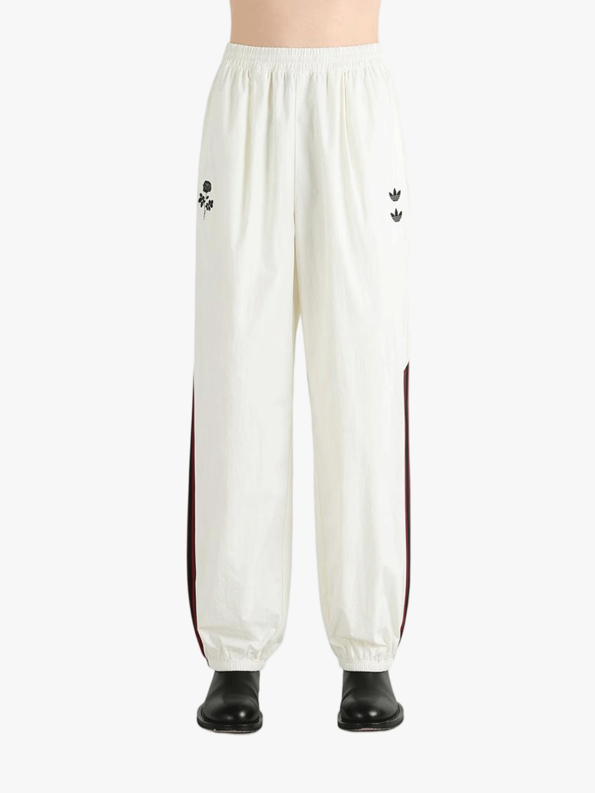 White pants worn by a person, showing the pants fit