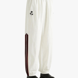 White pants worn by a person, showing the pants fit