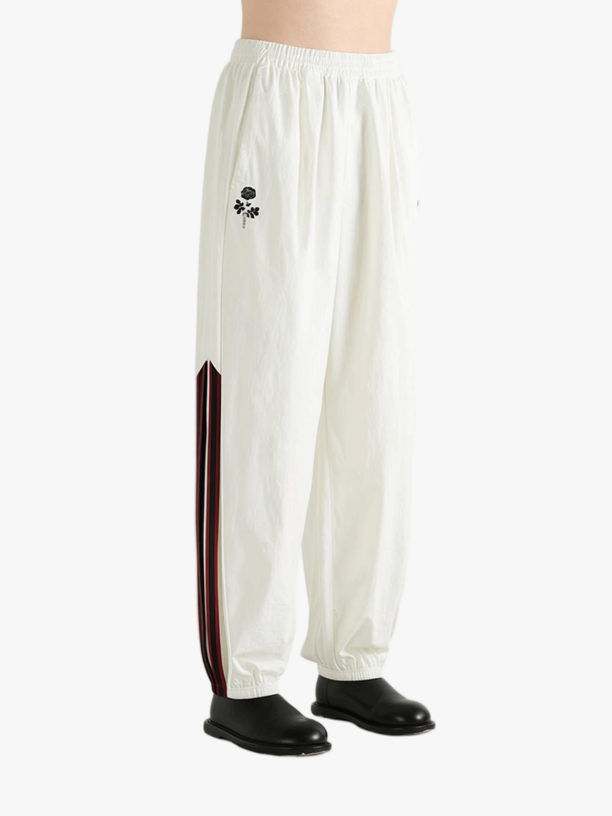 White pants worn by a person, showing the pants fit