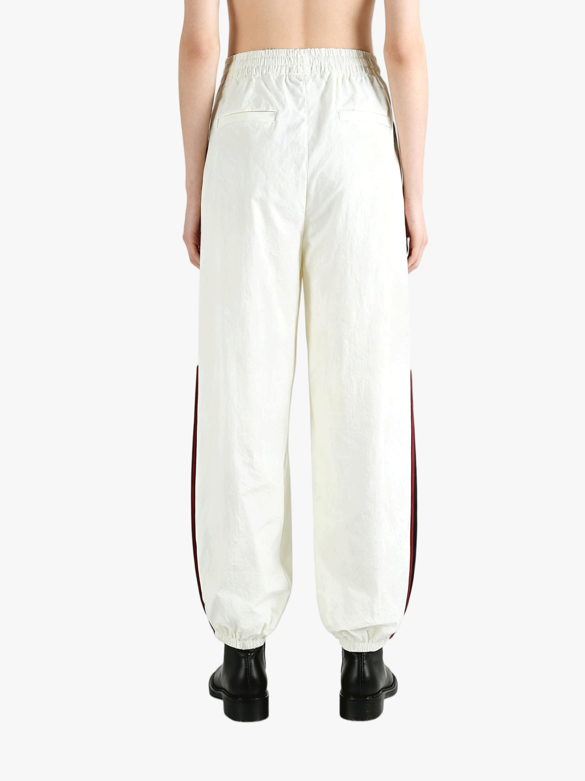 White pants worn by a person, showing the pants fit