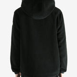 Black cardigan worn by a person, showing the cardigan fit