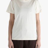 White t-shirt worn by a person, showing the shirt's fit