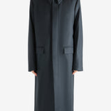 Black coat, worn by a person, showing the coat's fit