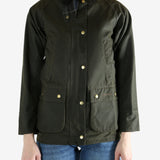 Green jacket worn by a person, showing the jacket fit