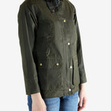 Green jacket worn by a person, showing the jacket fit