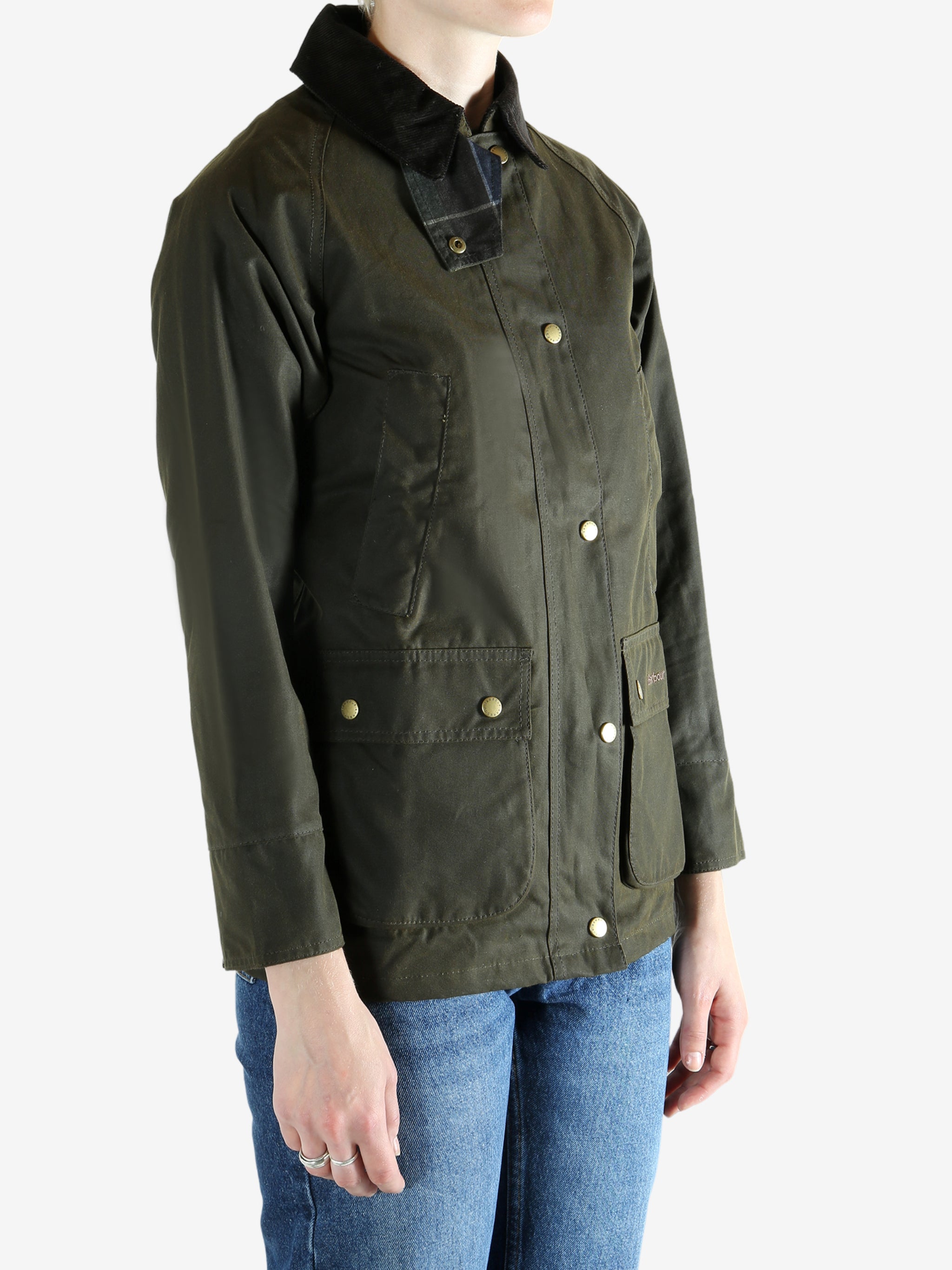 Green jacket worn by a person, showing the jacket fit