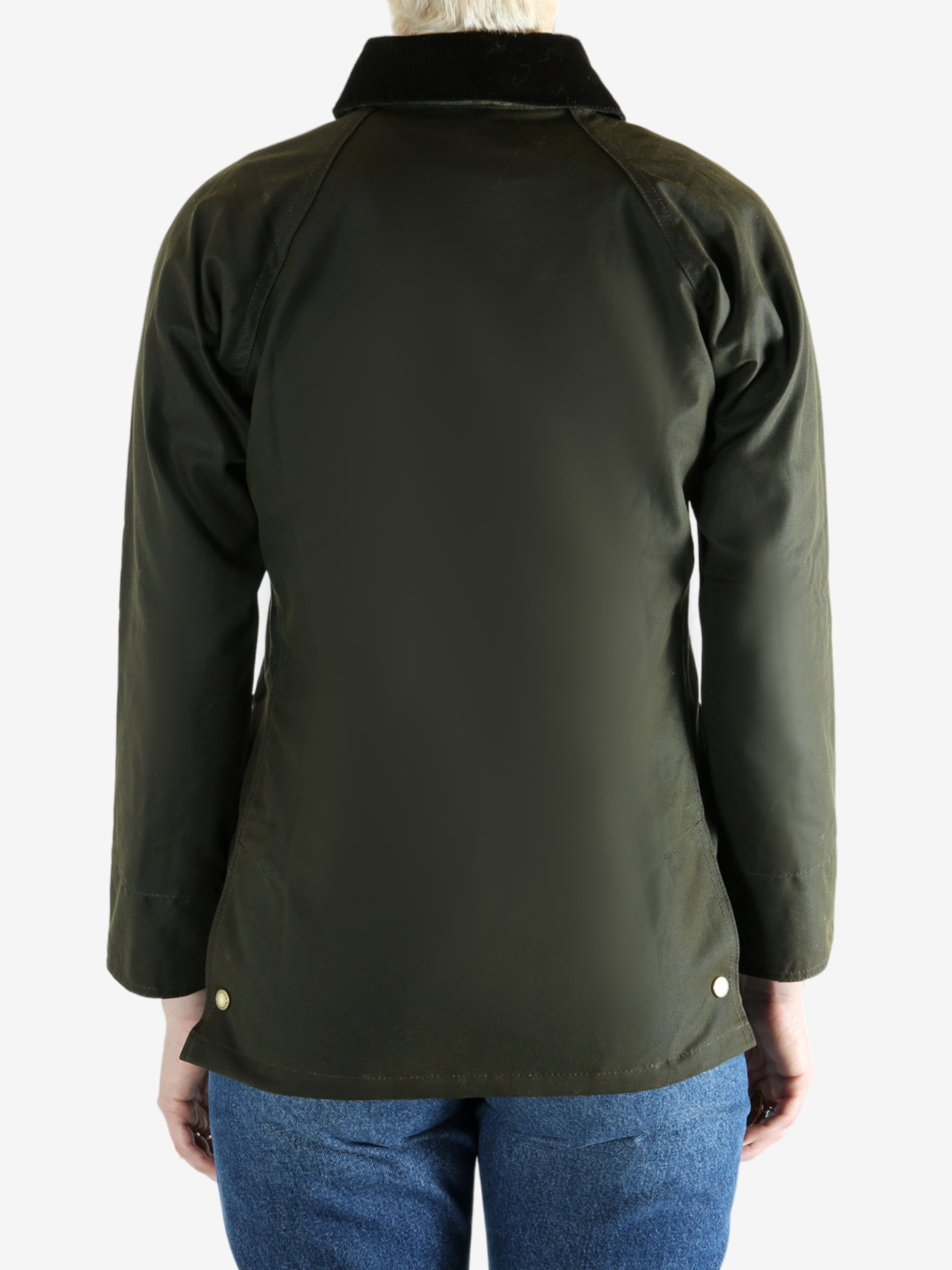 Green jacket worn by a person, showing the jacket fit