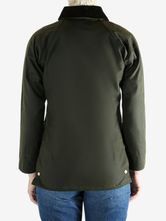 Green jacket worn by a person, showing the jacket fit