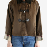 Brown jacket worn by a person, showing the jacket fit