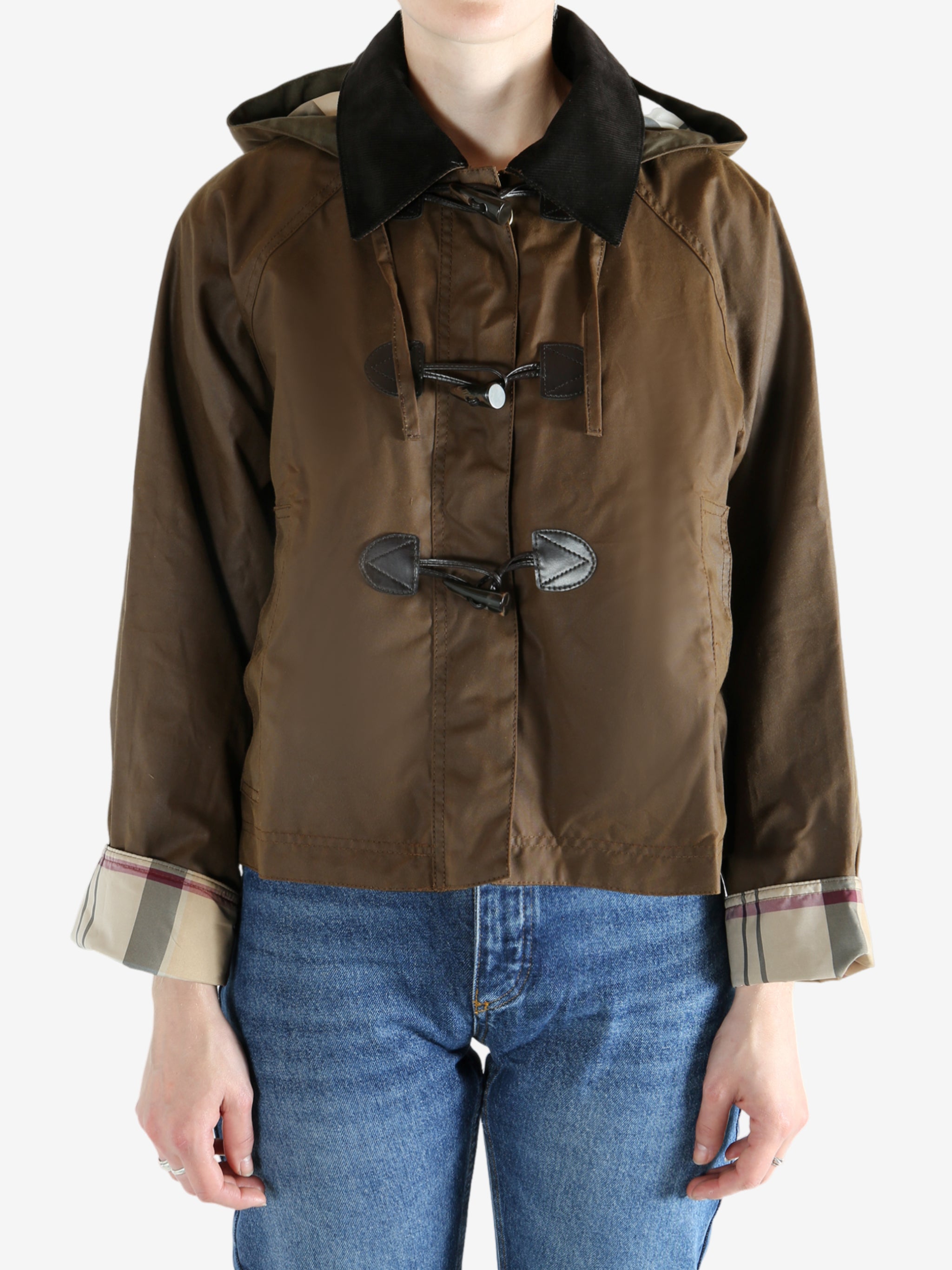 Brown jacket worn by a person, showing the jacket fit
