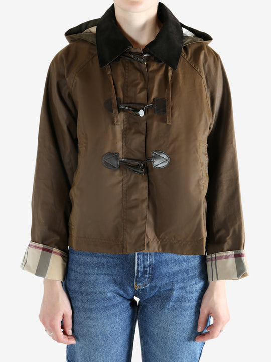 Brown jacket worn by a person, showing the jacket fit